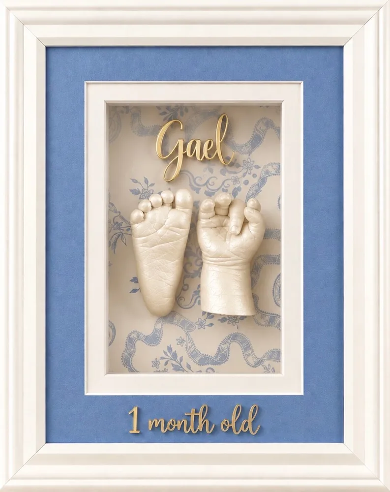 3D pearl white casts of a baby's hand and foot on a powder blue mat in a white frame, lettered Gael, 1 month old